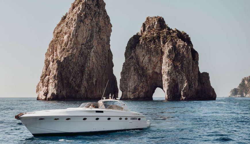 Explore the beauty of Capri aboard a private boat, sailing through the crystal-clear waters and charming coastlines of the island.